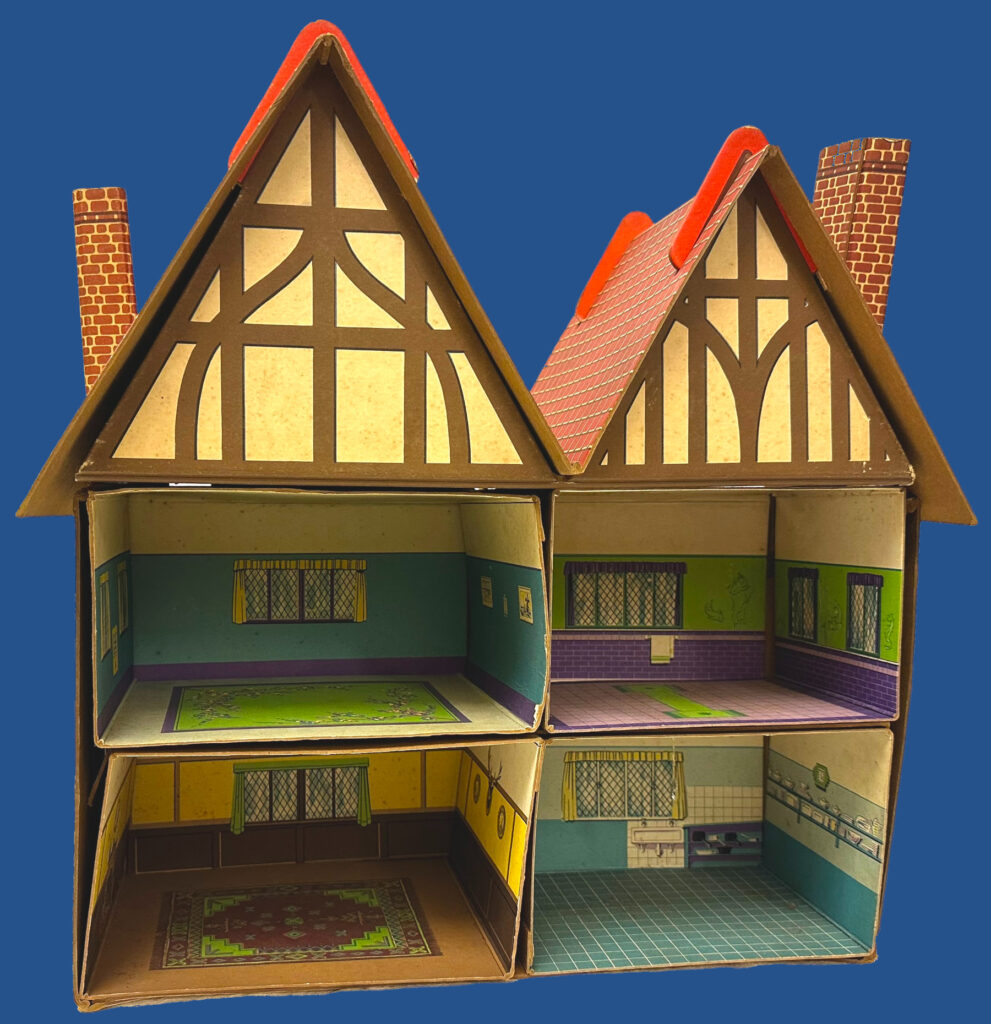 Interior view of the Meccano Dolly Varden doll's house, showing four rooms with printed-on windows, flooring, and simple decorations.